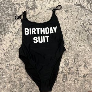 One piece bathing suit; black & white; “Birthday suit”; size small
